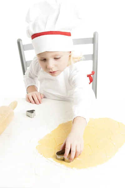 Girl cutting cookies — Stock Photo, Image