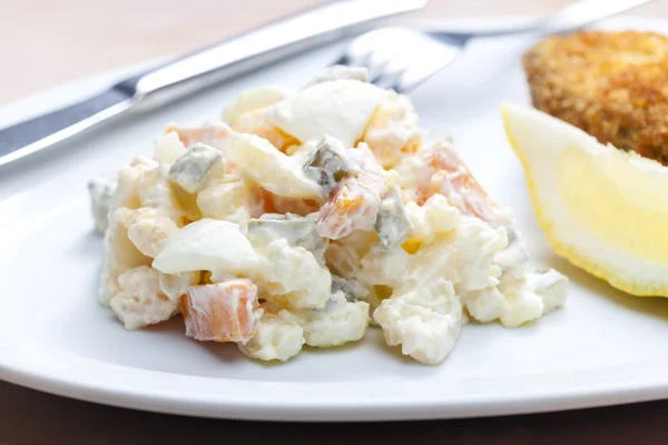 Fried carp with potato salad — Stock Photo, Image