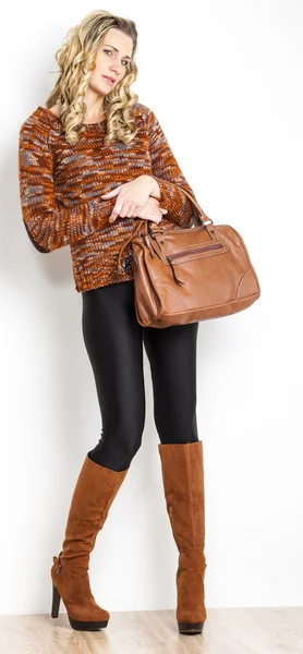 Standing woman wearing fashionable brown boots — Stock Photo, Image