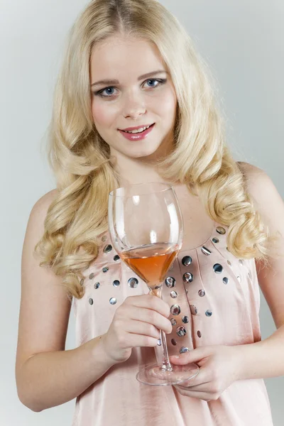 Woman with a glass of rose wine