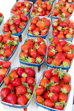 Strawberries, market in Nyons clipart