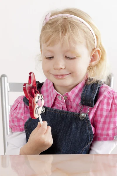 Little girl with an Easter lollipop — Stock Photo, Image