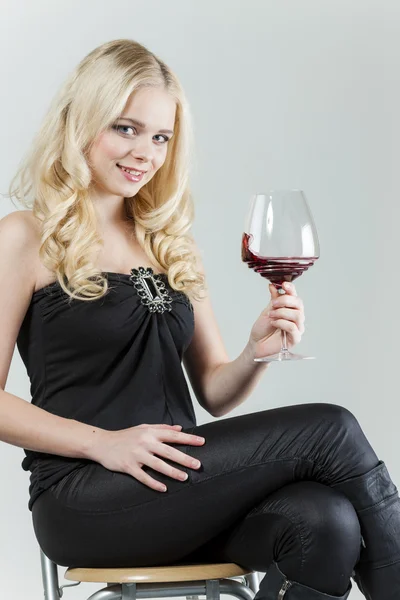 Young woman with a glass of red wine — Stock Photo, Image