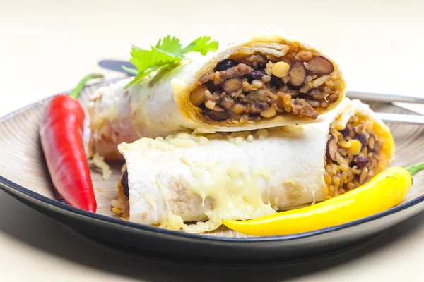 Burrito filled with beef minced meat and beans baked with gouda — Stock Photo, Image