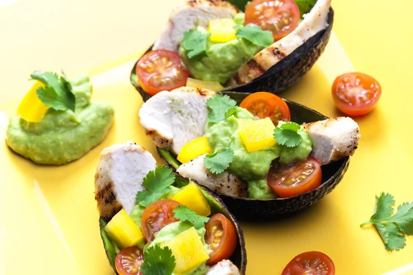 Avocado filled with chicken salad and avocado dip — Stock Photo, Image