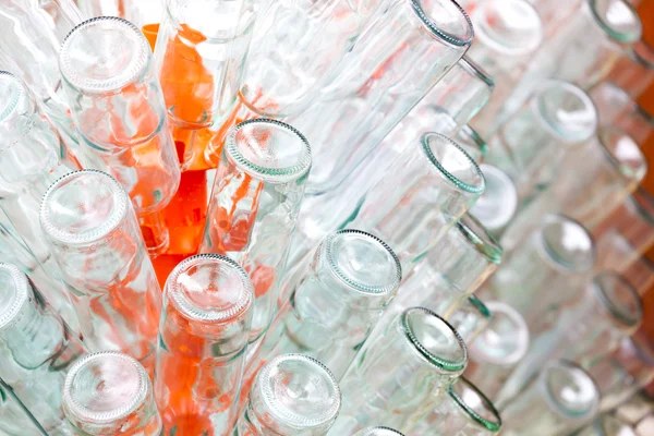 Empty bottles of wine on rack — Stock Photo, Image