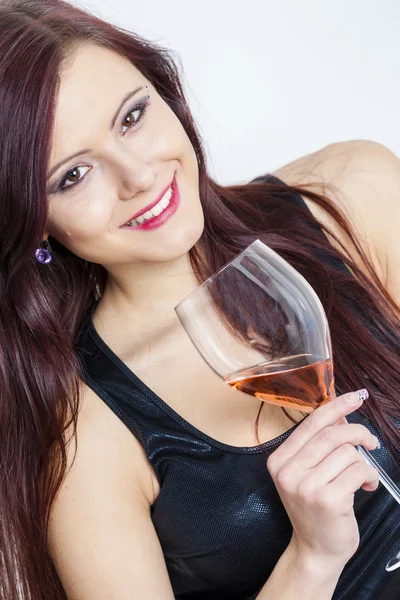 Portrait of young woman with a glass of rose wine — Stock Photo, Image