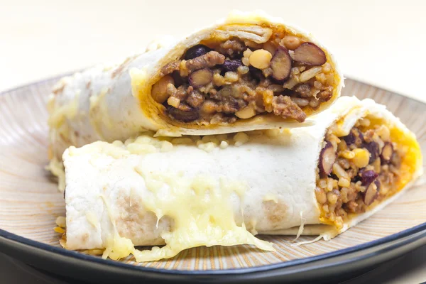 Burrito filled with beef minced meat and beans baked with gouda — Stock Photo, Image