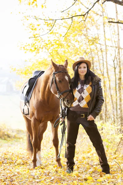 Equestrian with her horse — Stock Photo, Image