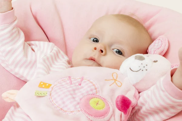 Portrait of three months old baby girl with a toy — Stock Photo, Image