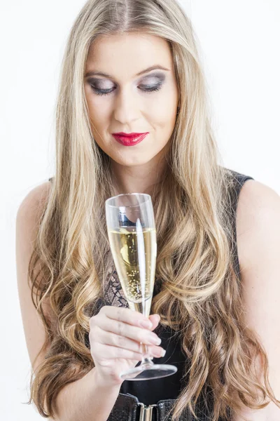 Portrait of young woman with a glass of champagne — Stock Photo, Image