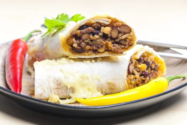 Burrito filled with beef minced meat and beans baked with gouda — Stock Photo, Image