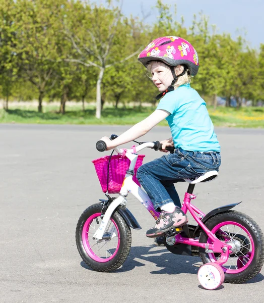Little biker girl Stock Image