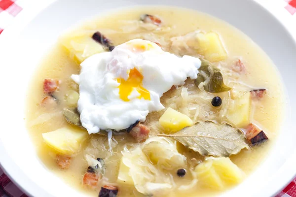 Sauerkraut soup with veiled egg — Stock Photo, Image