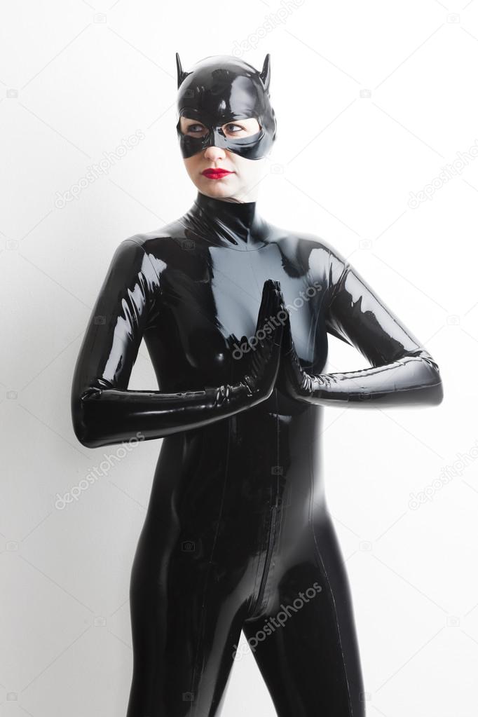 Standing woman wearing latex clothes