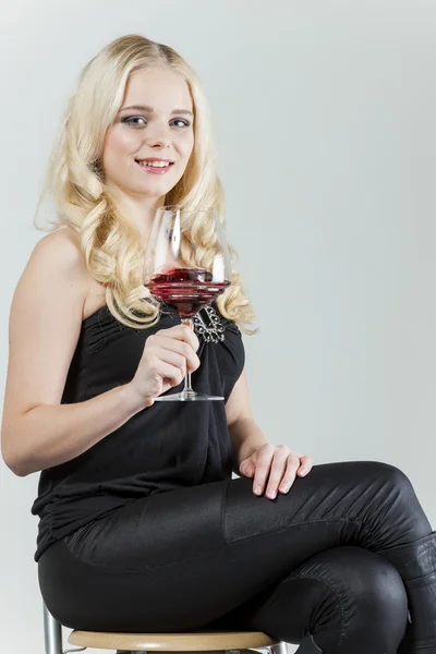 Young woman with a glass of red wine — Stock Photo, Image