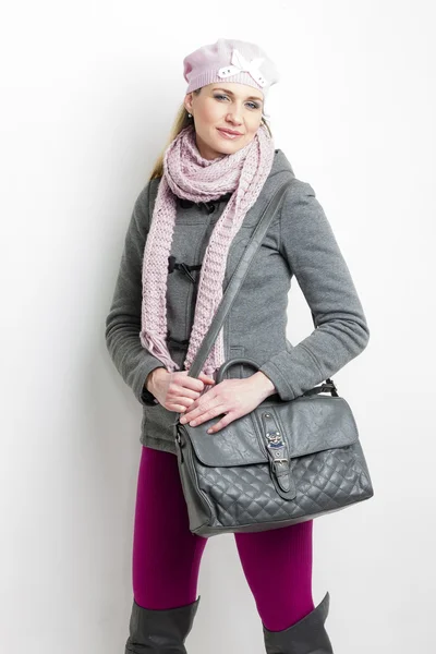 Portrait of woman wearing winter clothes with a handbag — Stock Photo, Image