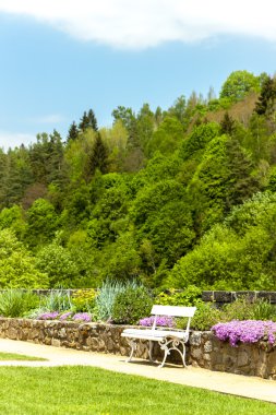 Spring garden with a bench, Becov nad Teplou clipart
