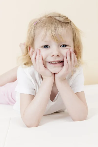 Portrait of lying little girl — Stock Photo, Image