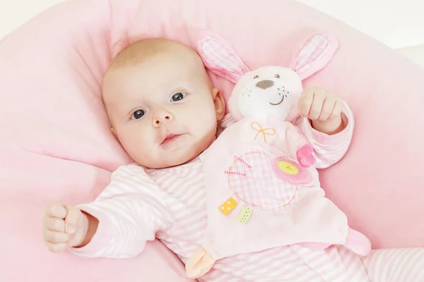 Portrait of three months old baby girl with a toy — Stock Photo, Image