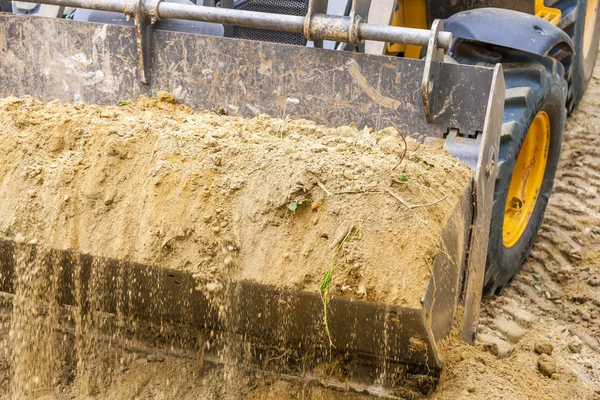 Detalhe da escavadeira no canteiro de obras — Fotografia de Stock