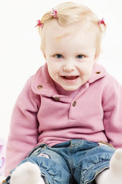 Portait of sitting little girl wearing jeans — Stock Photo, Image