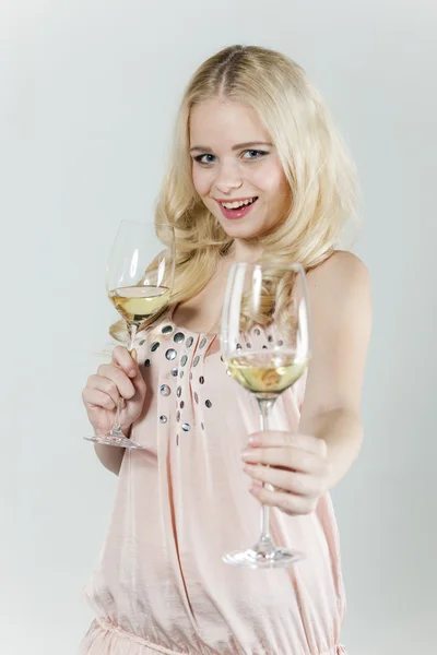 Portrait of young woman with glasses of white wine — Stock Photo, Image