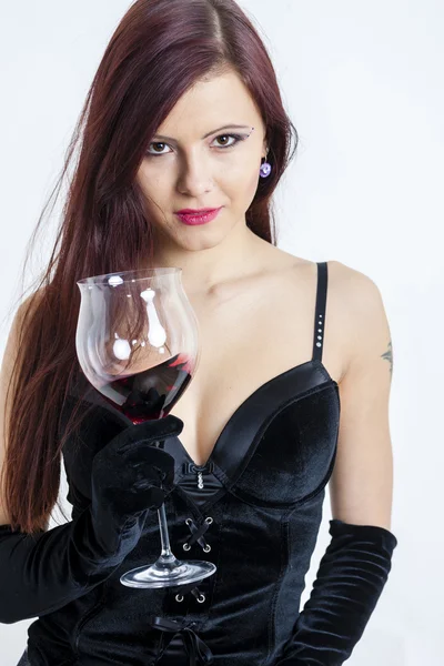 Young woman with a glass of red wine — Stock Photo, Image