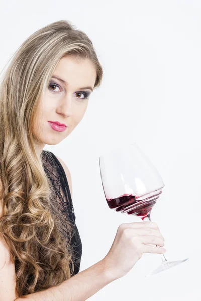 Portrait of young woman with a glass of red wine — Stock Photo, Image