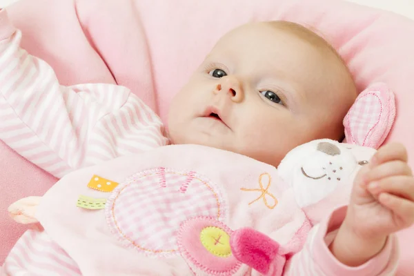 Portrait of three months old baby girl with a toy — Stock Photo, Image