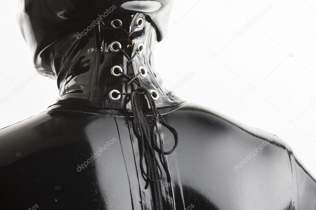 detail of standing woman wearing latex clothes