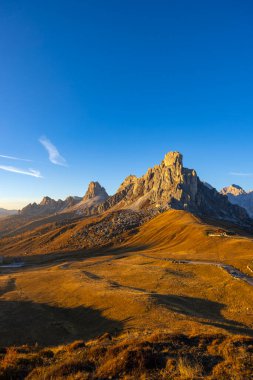 Alpine landscape featuring Monte Ra Gusela at Passo Giau in the Italian Dolomites during golden hour