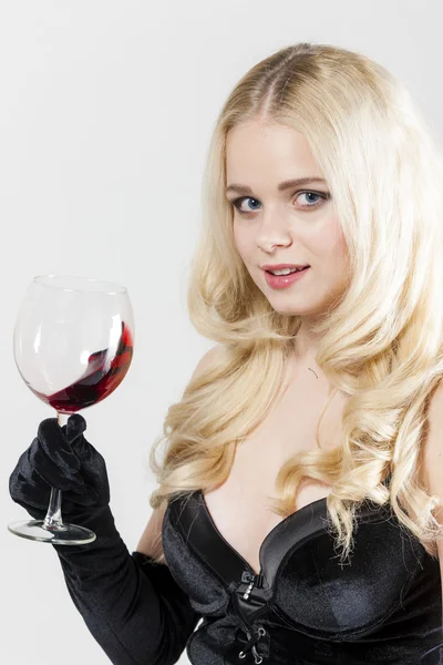 Portrait of young woman with a glass of red wine Royalty Free Stock Photos