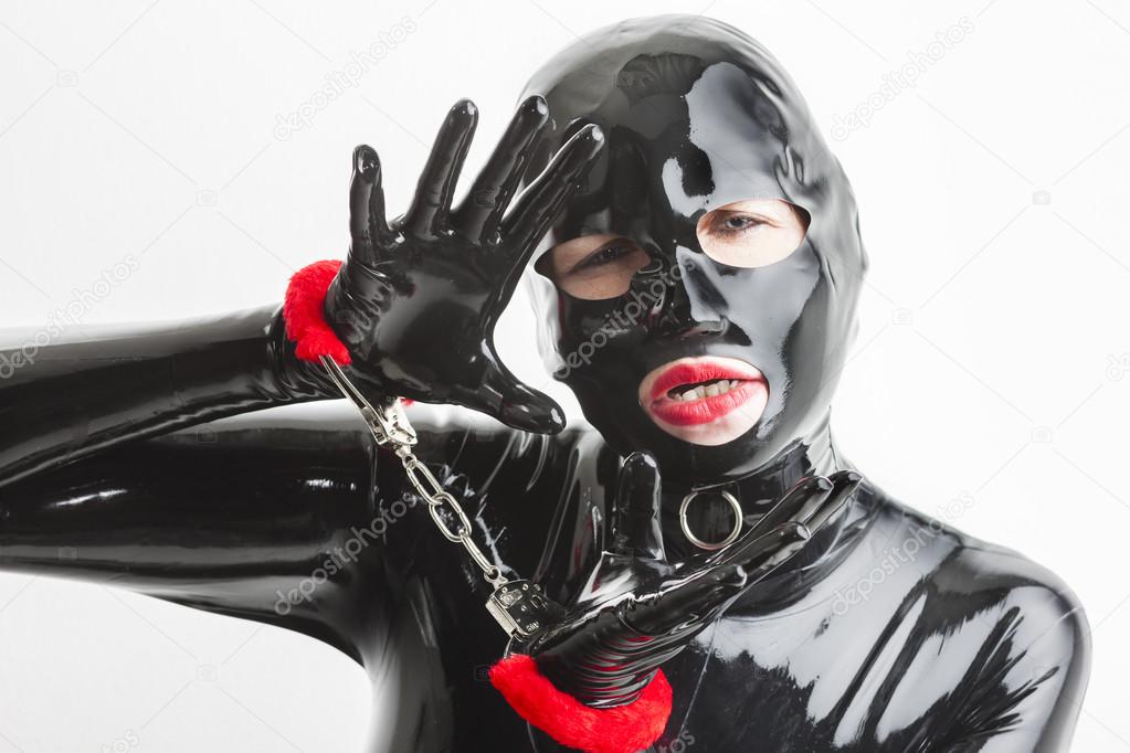 woman wearing latex clothes with handcuffs