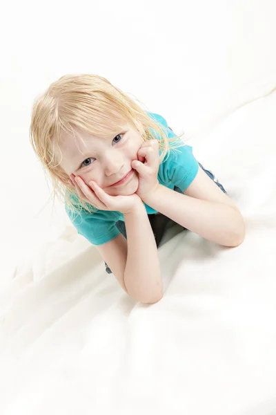 Portrait of lying little girl — Stock Photo, Image