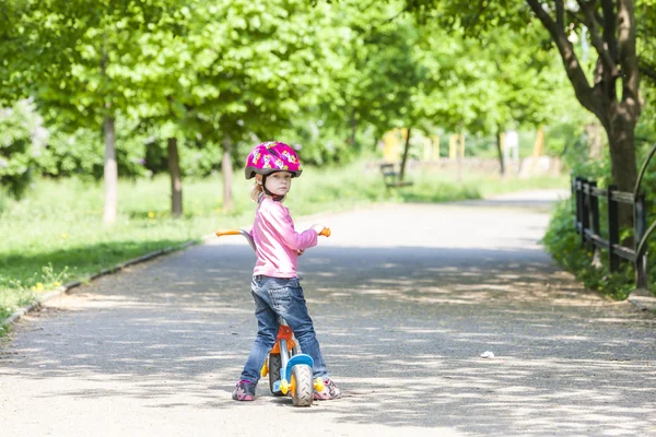 Little girl with a scooter — Stock Photo, Image