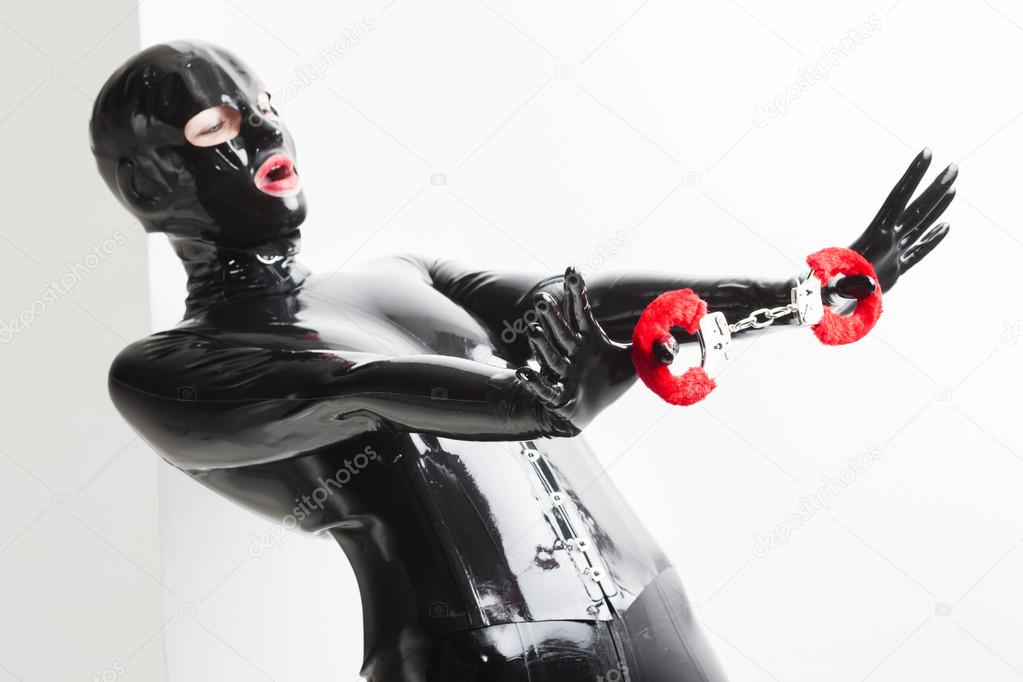 woman wearing latex clothes with handcuffs