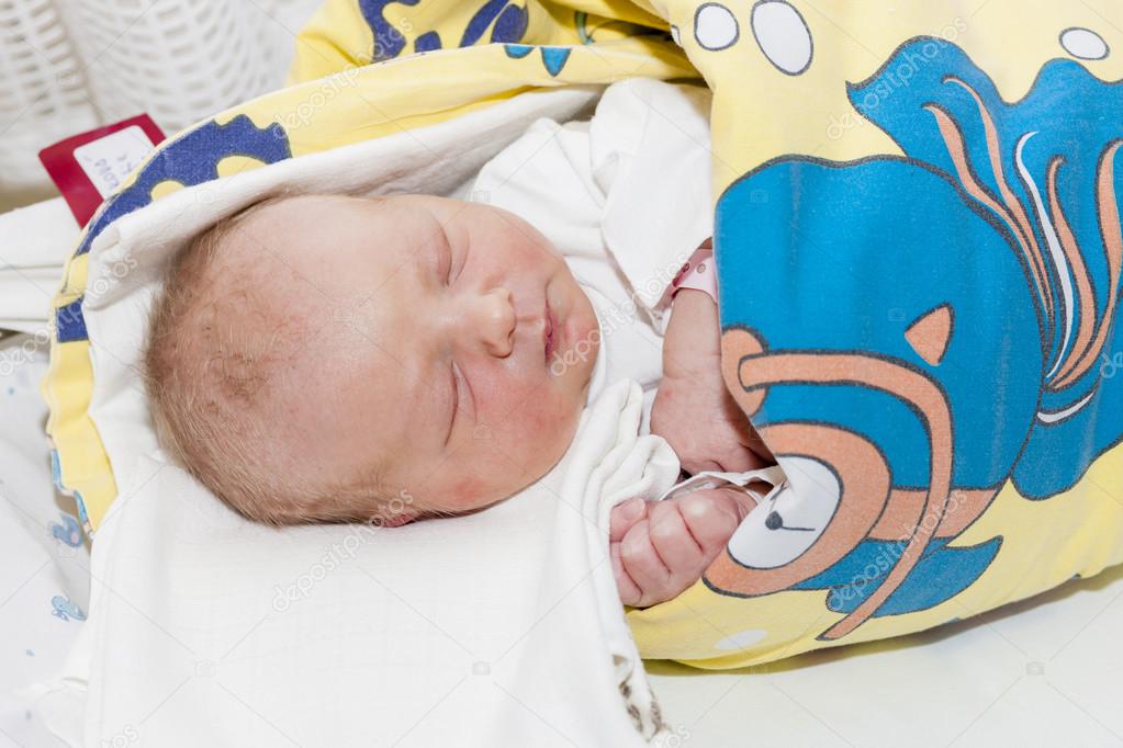 newborn baby girl in maternal hospital