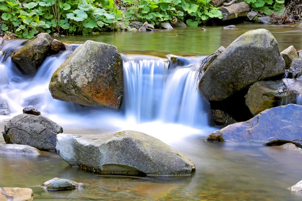 Small waterfall on mountain brook — Stock Photo, Image