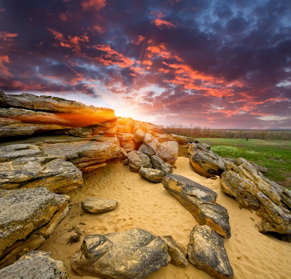 Stones desert on sunset background — Stock Photo, Image