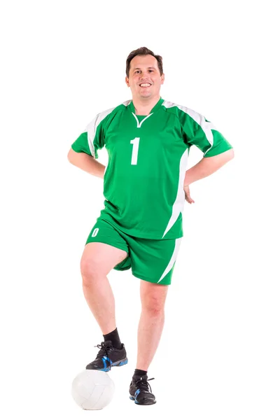Mogen man klädd i gröna sportkläder poserar — Stockfoto