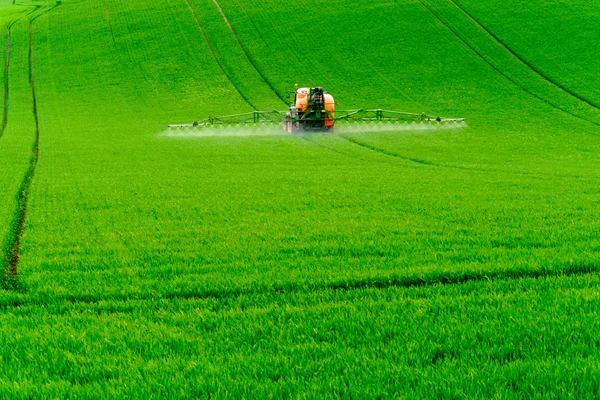 Tractor spraying the chemicals — Stock Photo, Image