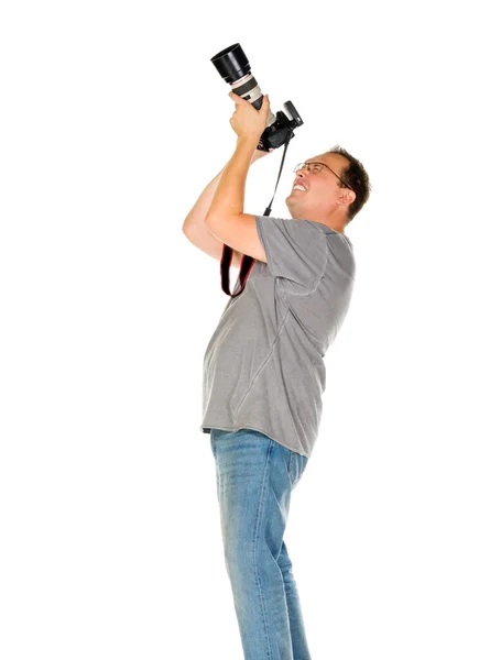 Young man traveler taking pictures by dslr camera isolated — Stock Photo, Image