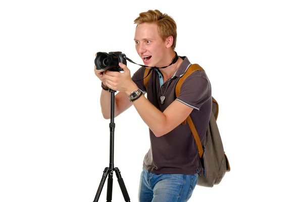 Young man traveler taking pictures by dslr camera isolated — Stock Photo, Image