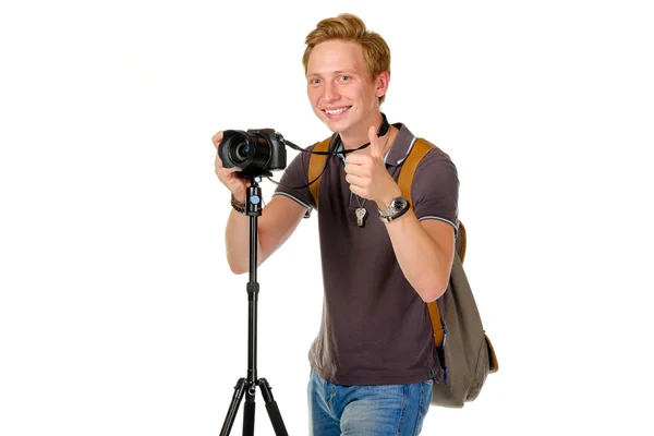 Young man traveler taking pictures by dslr camera isolated — Stock Photo, Image