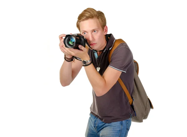 Young man traveler taking pictures by dslr camera isolated — Stock Photo, Image