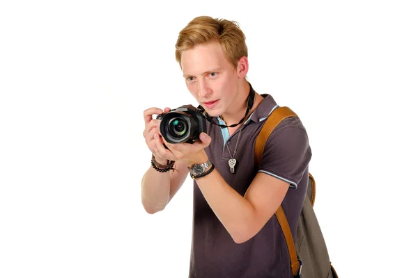 Young man traveler taking pictures by dslr camera isolated — Stock Photo, Image