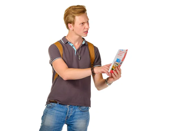 Young man traveler looking for a destination with map — Stock Photo, Image