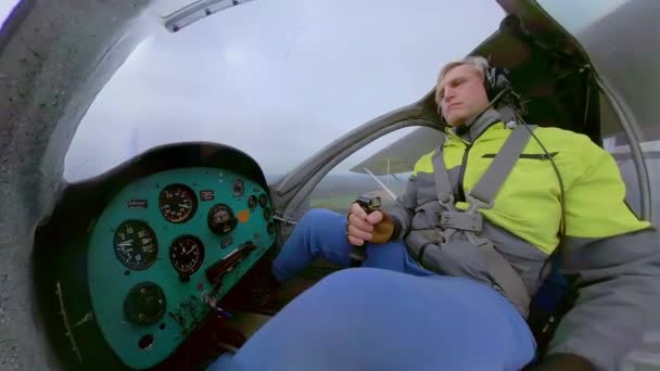 Man piloting plane over countryside — Stock Video