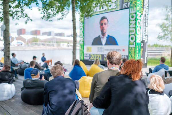 People participating in open air conference